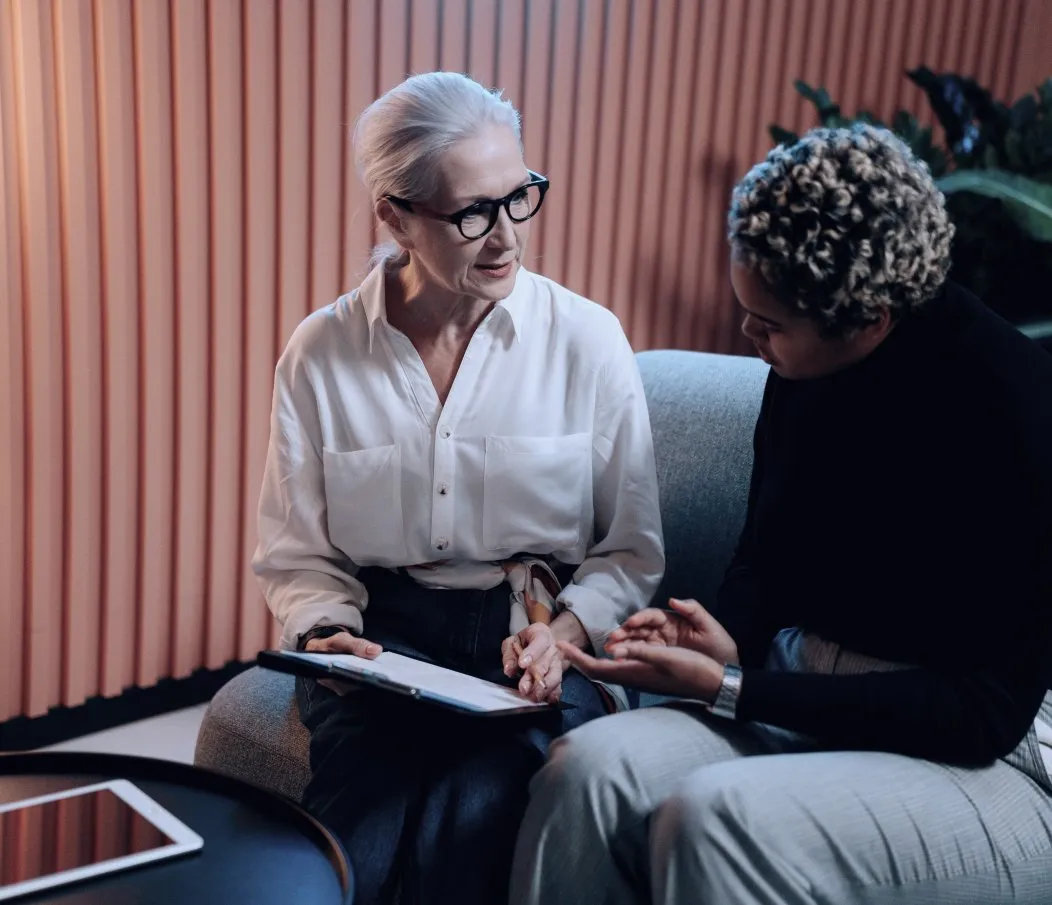Consultant reviewing notes with a client